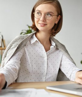 thoughtful-businesswoman-with-bobbed-hairstyle-dressed-in-white-blouse-writes-with-pen-in-diary-an.jpg